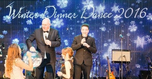 Dara Ó Briain draws the lucky winner of a brand new car at Digby Brown's Winter Dinner Dance for Spinal Injuries Scotland