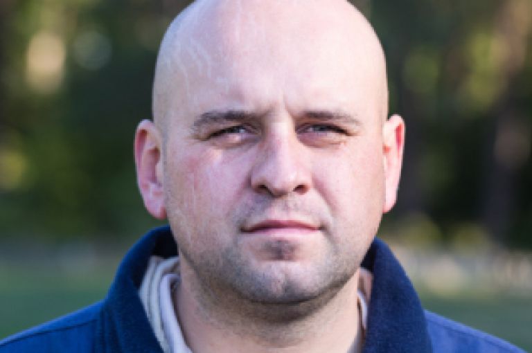 Man in park looking to camera