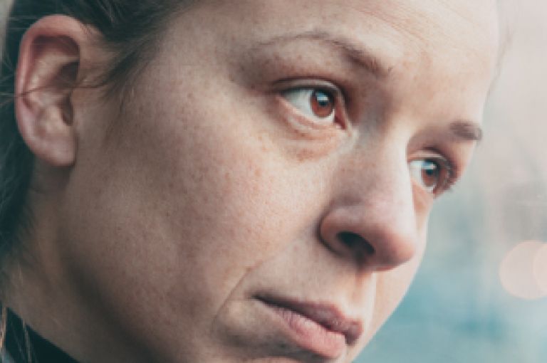 Woman looking out of window