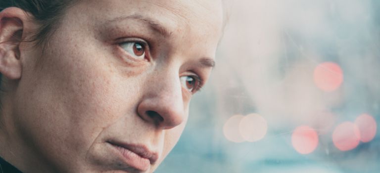 Woman looking out window