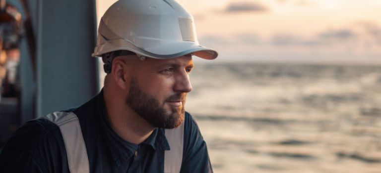 Offshore worker looking out to sea