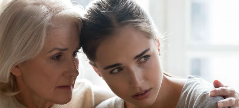 Mother and daughter looking concerned