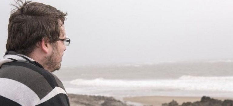 Man looking out to sea